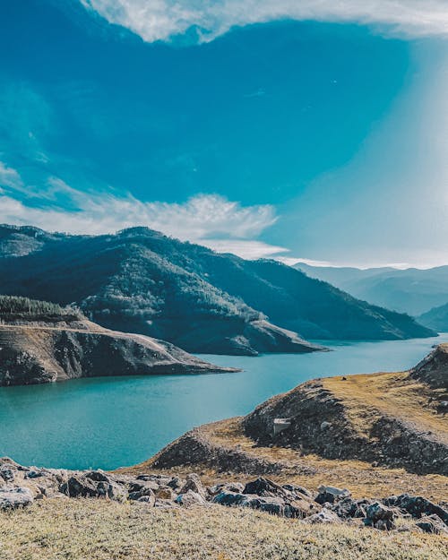 Blue Lake between Mountains under the Blue Sky