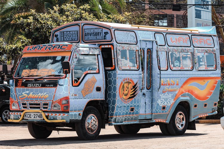 Blue And Orange Bus On The Road