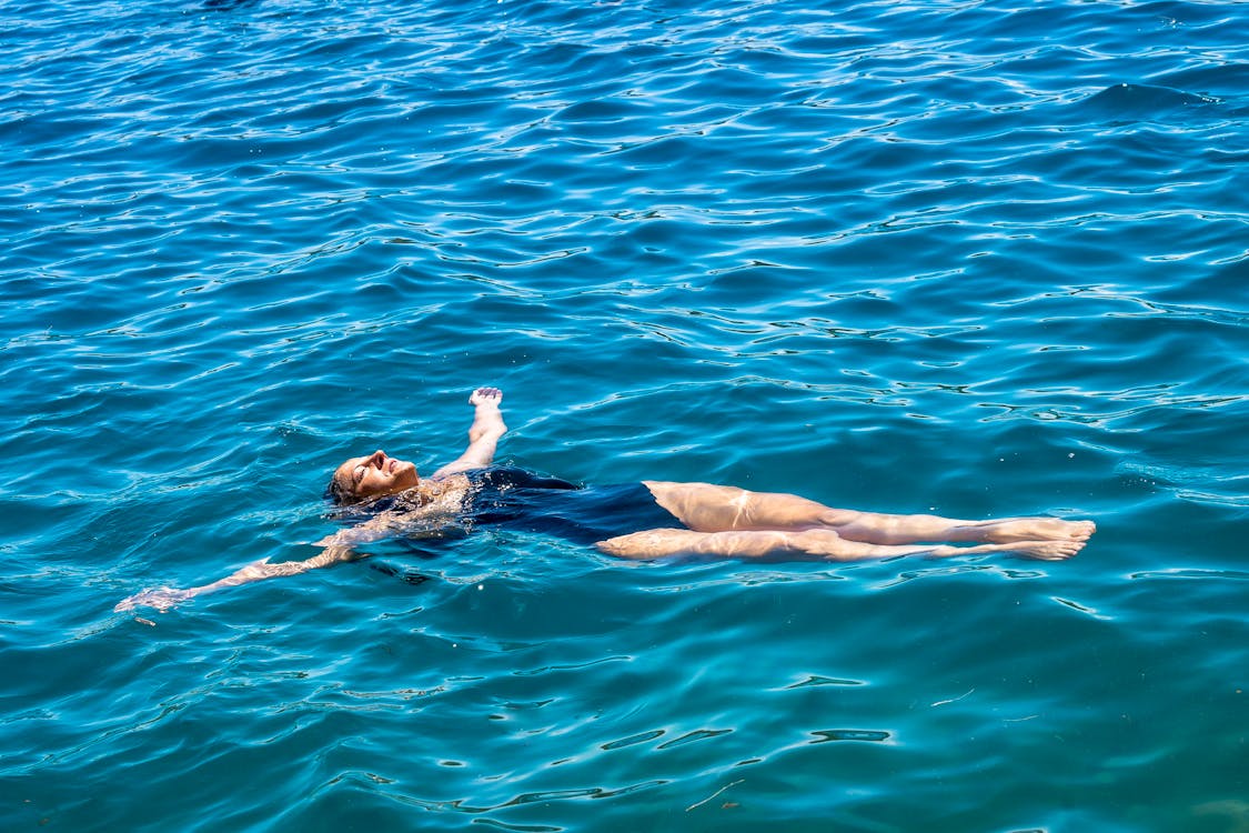 A Woman Floating on the Sea
