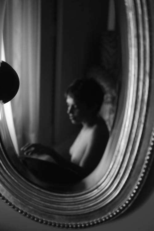 Reflection of a Woman in the Mirror