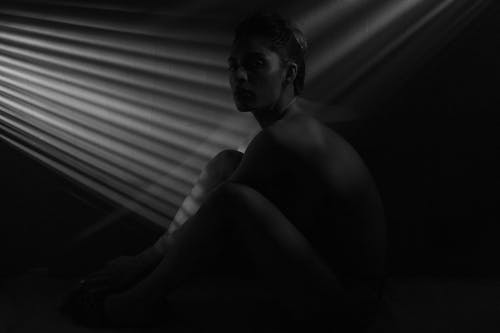 Grayscale Photo of a Topless Woman