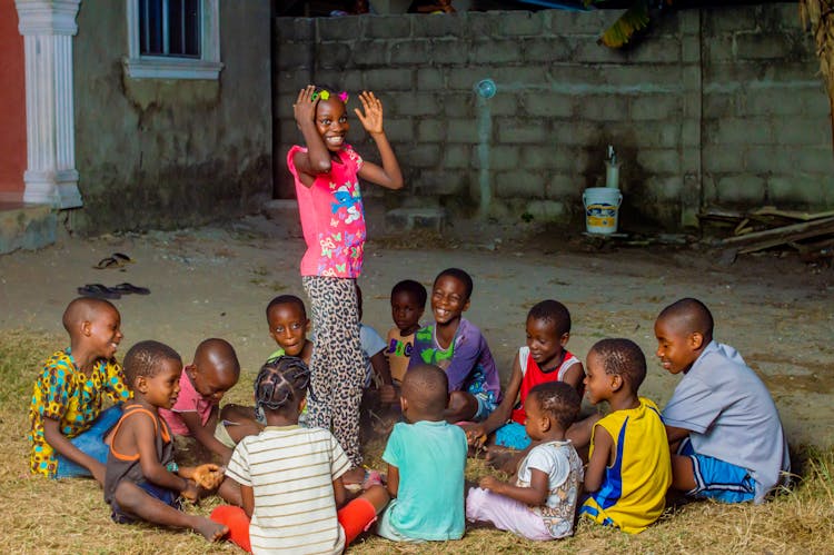 Kids Playing On The Ground