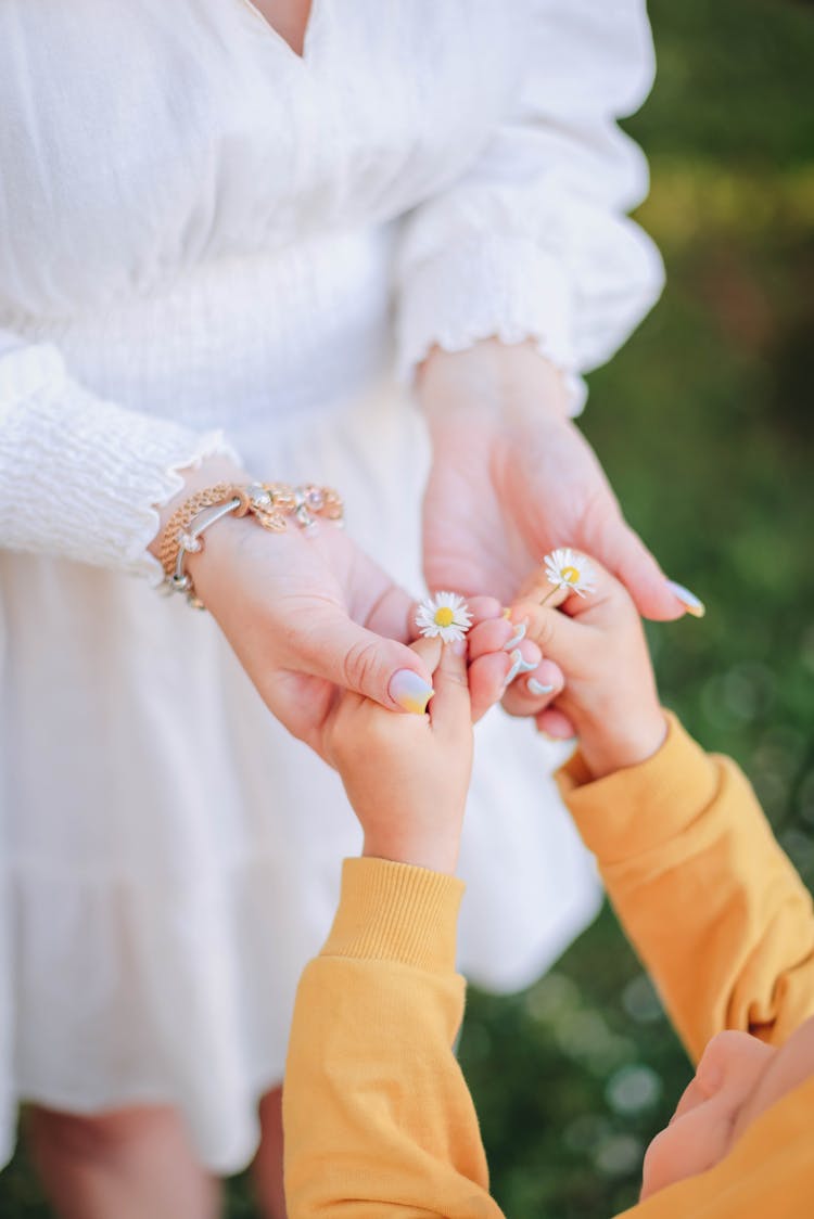 Female Hands Holding Child Hands