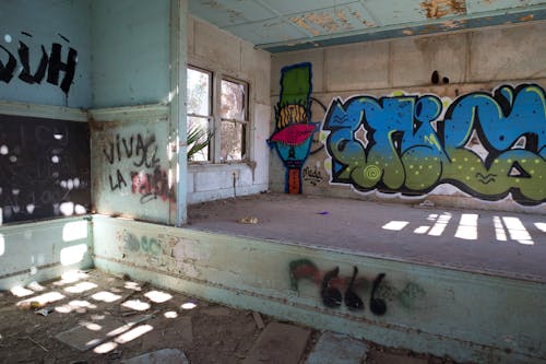 Interior of an Abandoned Building with Graffiti on Walls