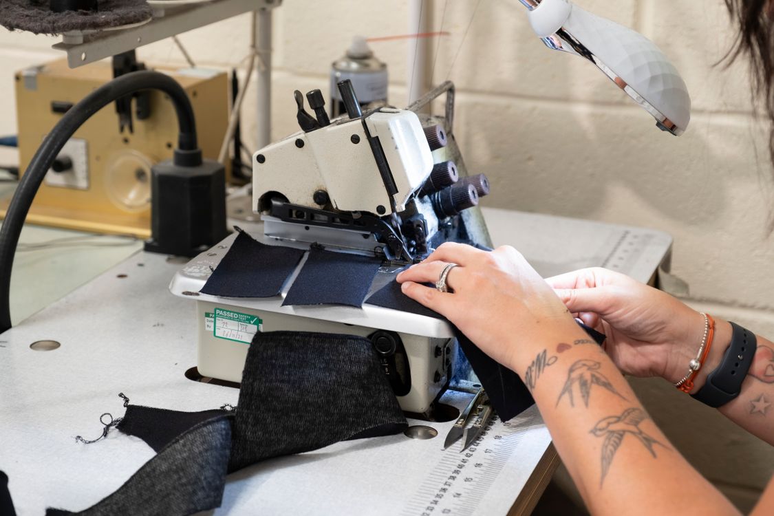 Person Using Stitching Machine A Person Using Sewing machine · Free Stock Photo