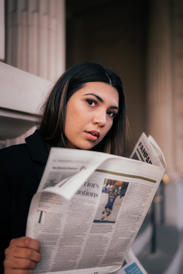 Portrait Of A Woman Reading A Newspaper