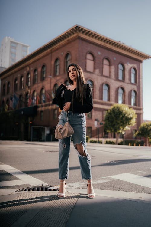 Woman Posing on Sidewalk