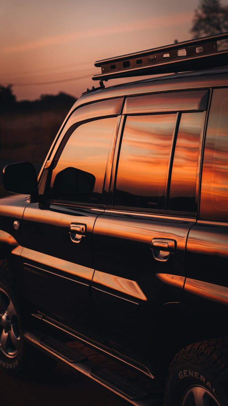 Black SUV Car During Sunset