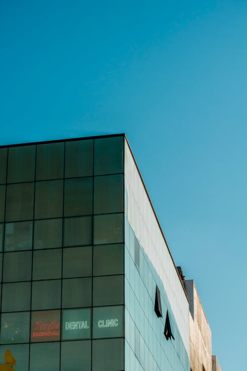 Glass Skyscraper against Clear Sky