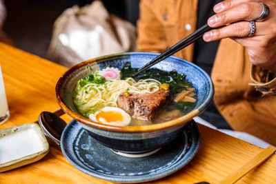 A noodle bowl in hot broth with chopsticks, photo by Viridiana Rivera on Pexels