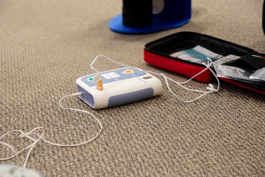 Closeup of a Sound Equipment Charging on an Aligned Carpet