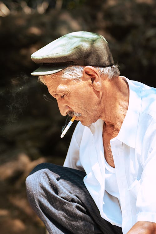 Elderly Man Smoking Cigarette