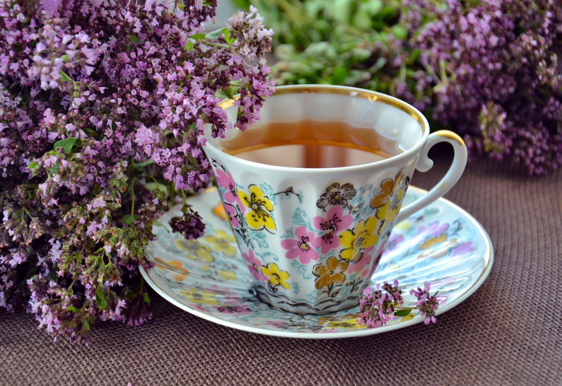 Photo of White-pink-and-yellow Ceramic Mug and Saucer