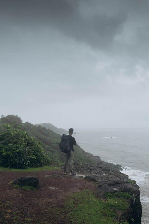 A Man Standing on the Cliff