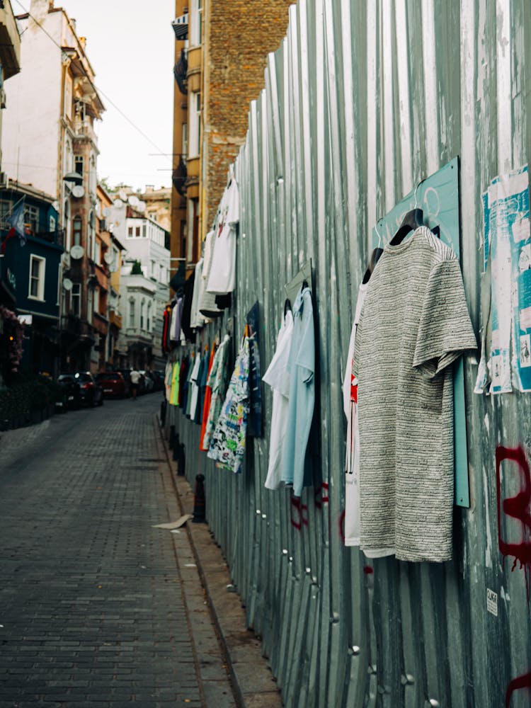 Clothes Hanging On Wall In Town