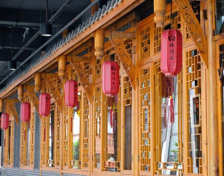 Row of red Chinese lanterns decorating a traditional building in Kuala Lumpur, Malaysia.