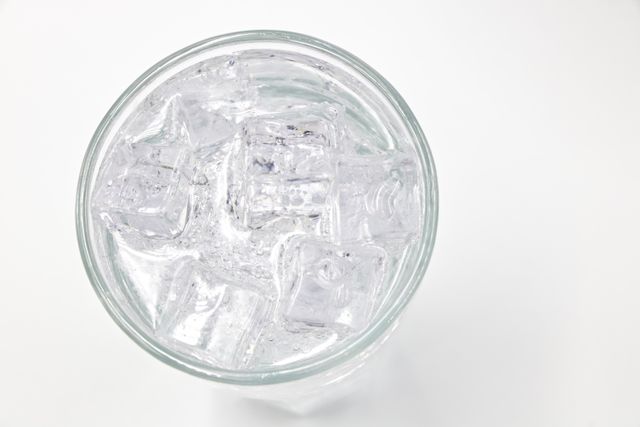 Glass of ice cubes similar to what a properly working ice maker produces in The Colony, TX homes
