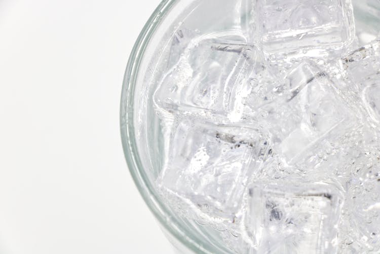 A Glass Of Sparkling Soda Water With Ice Cubes 