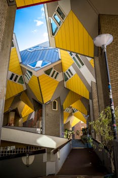 Dynamic view of Rotterdam's iconic Cube Houses showcasing geometric design and vibrant colors.