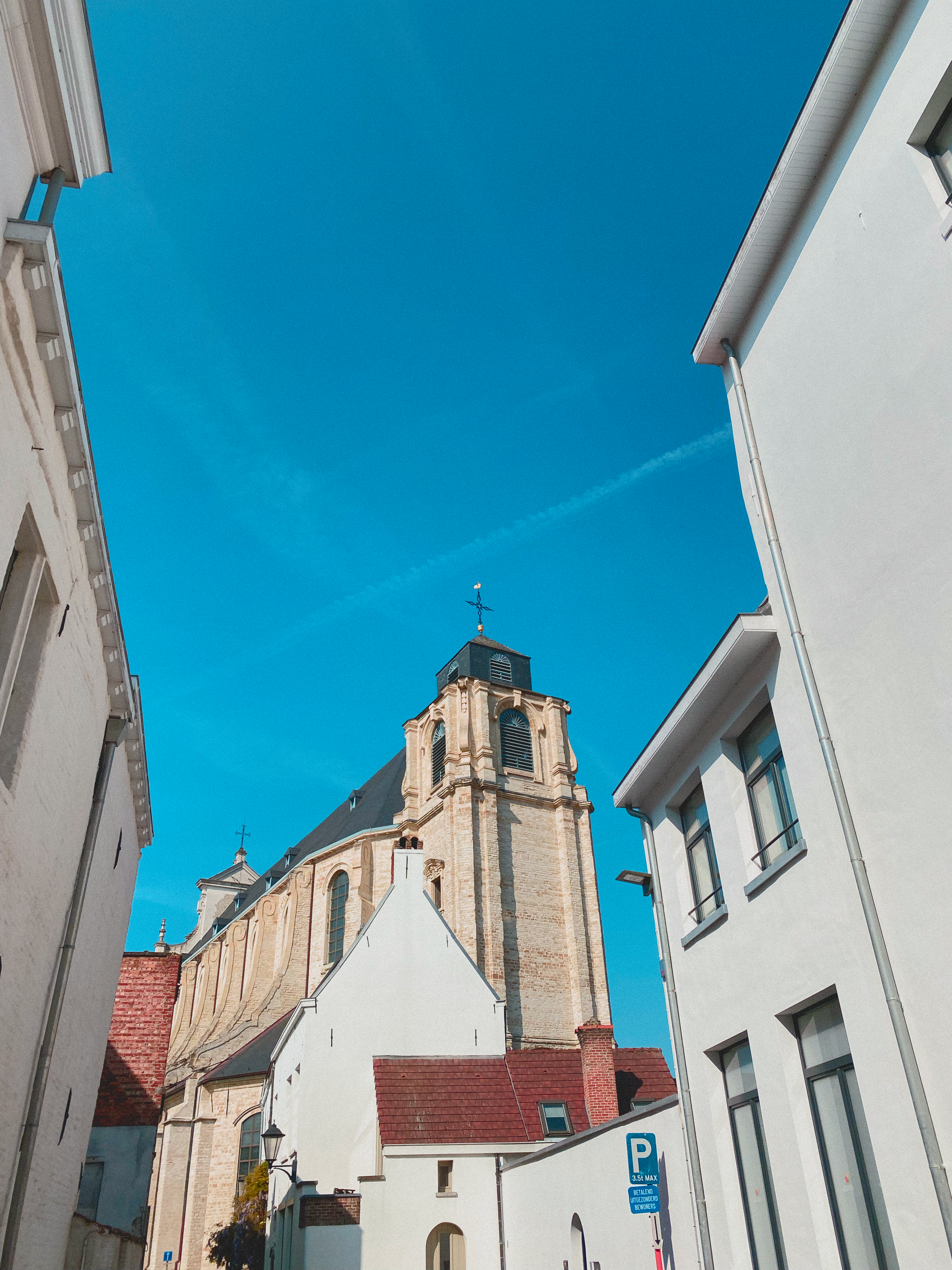 Low-Angle Shot of Concrete Buildings under the Blue Sky · Free Stock Photo