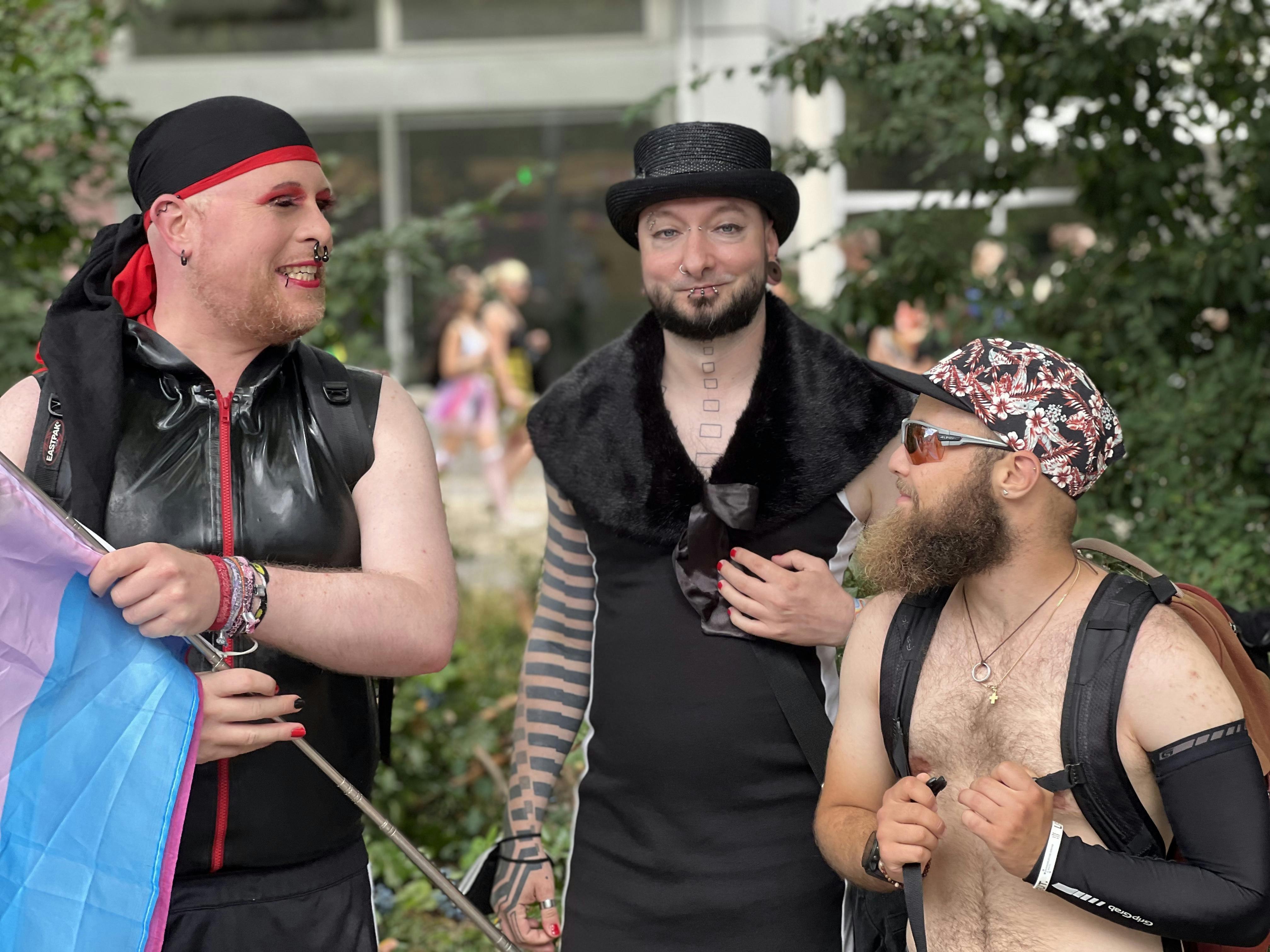 Men in vibrant costumes celebrate diversity at the Berlin Pride Parade.