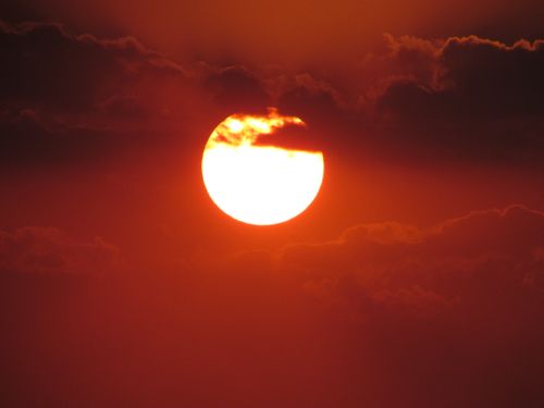 Free Stunning sunset with vibrant colors and dramatic clouds in the sky. Stock Photo