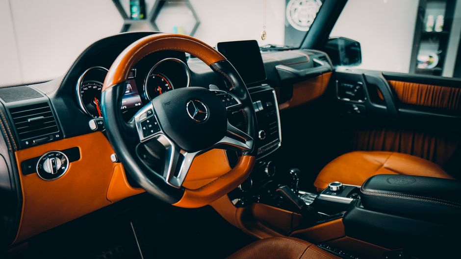 Explore the plush interior of a Mercedes-Benz G-Class featuring premium materials and modern design.