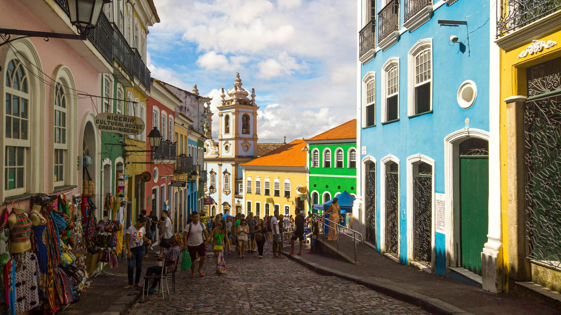 Vibrant street scene in Pelourinho, Salvador, Bahia, showcasing colonial architecture and local culture.