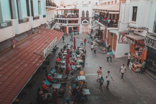 People Spending Time at an Outdoor Cafe of a Town