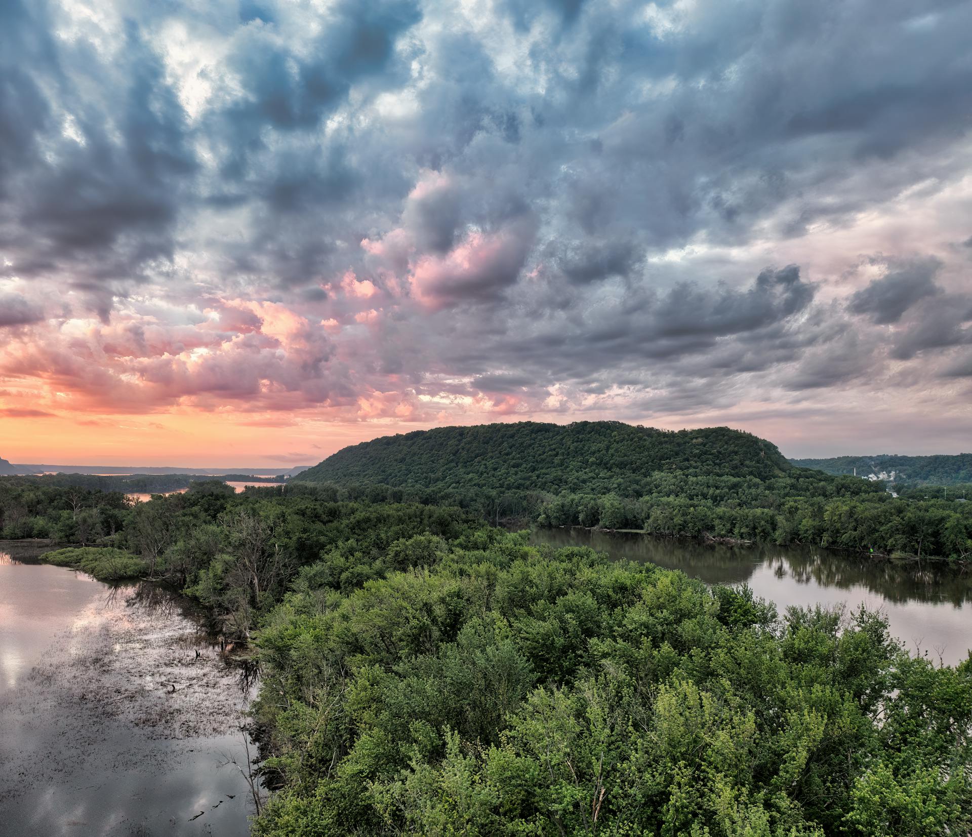 Stunning aerial view of the Mississippi River and lush forests at sunset in Red Wing, Minnesota.