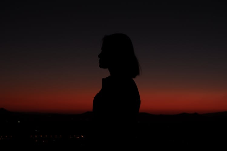 Silhouette Of A Woman At Sunset