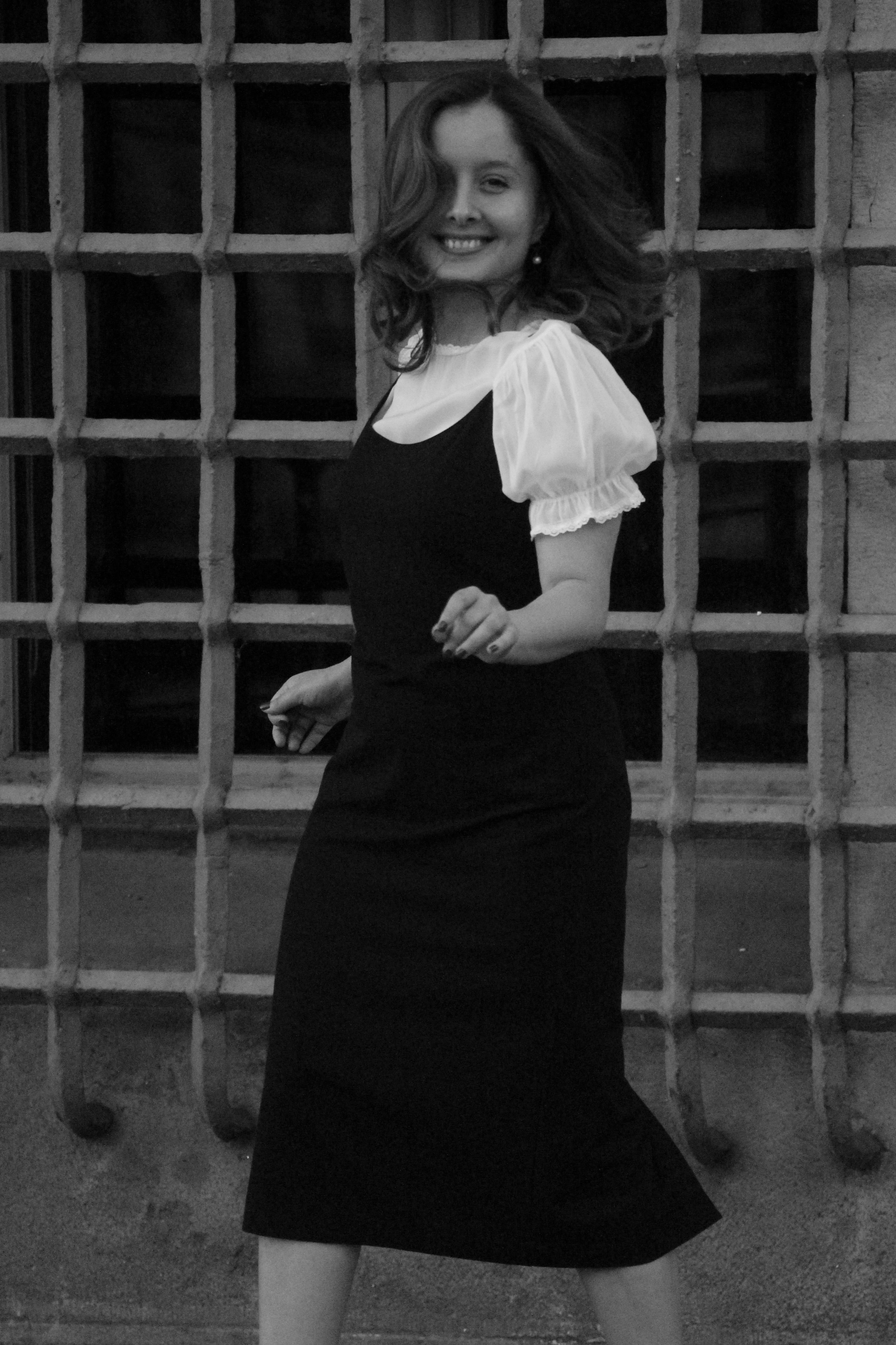 A Grayscale Photo of a Woman in Long Backless Dress · Free Stock Photo