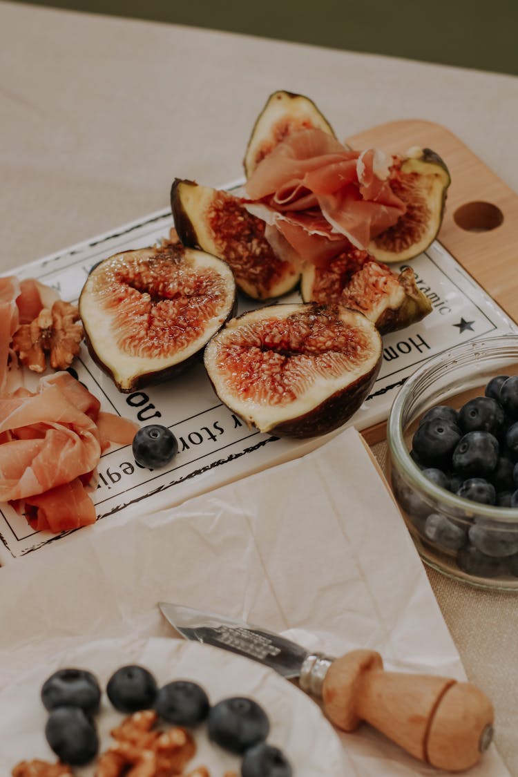 Sliced Figs Near Blueberries