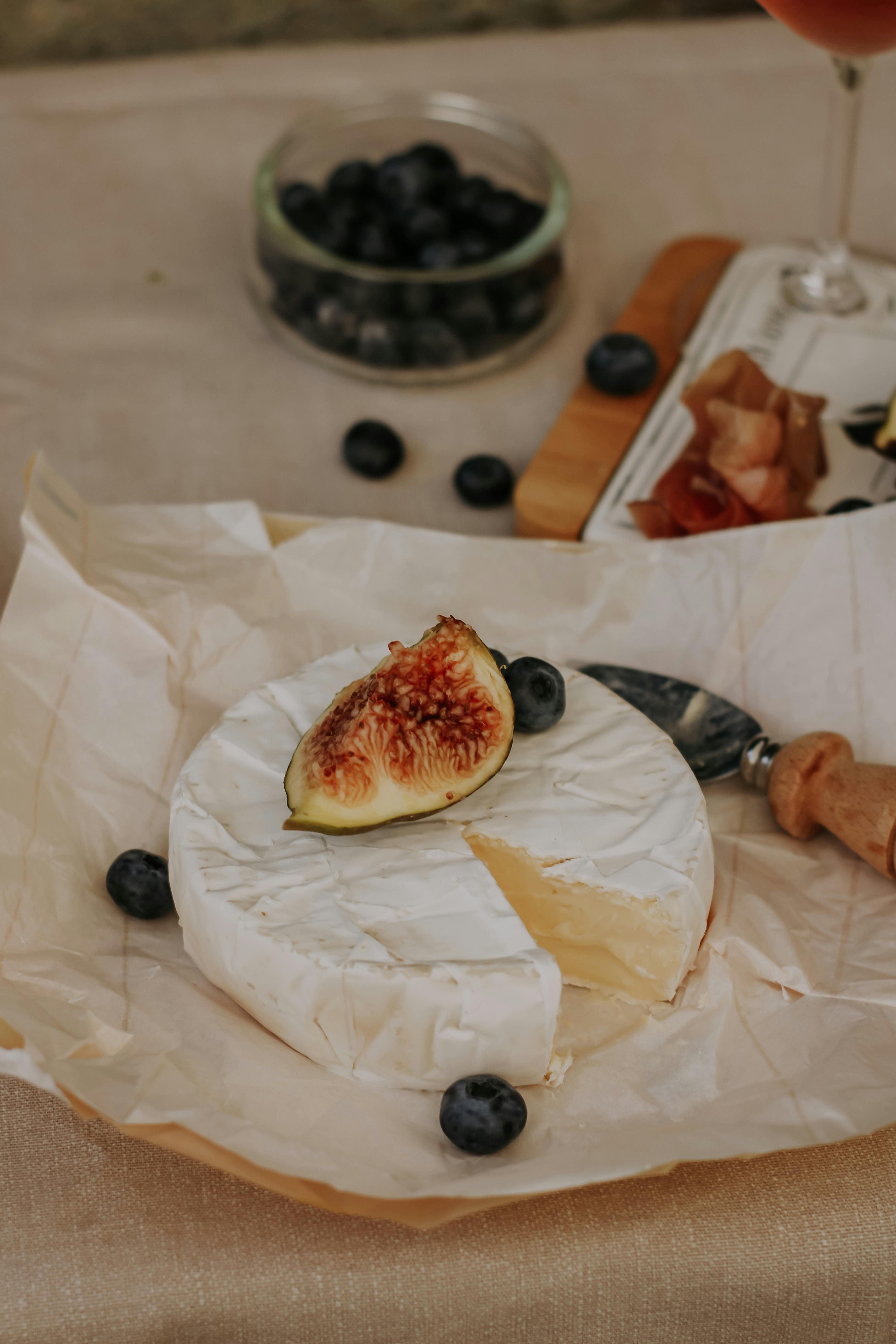 brie and fruit on table