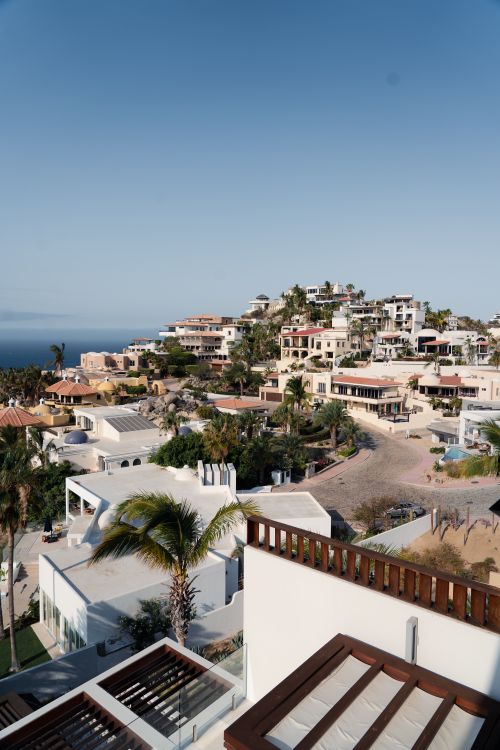 Free Panoramic view of luxury villas in Cabo San Lucas, Mexico under a clear blue sky. Stock Photo