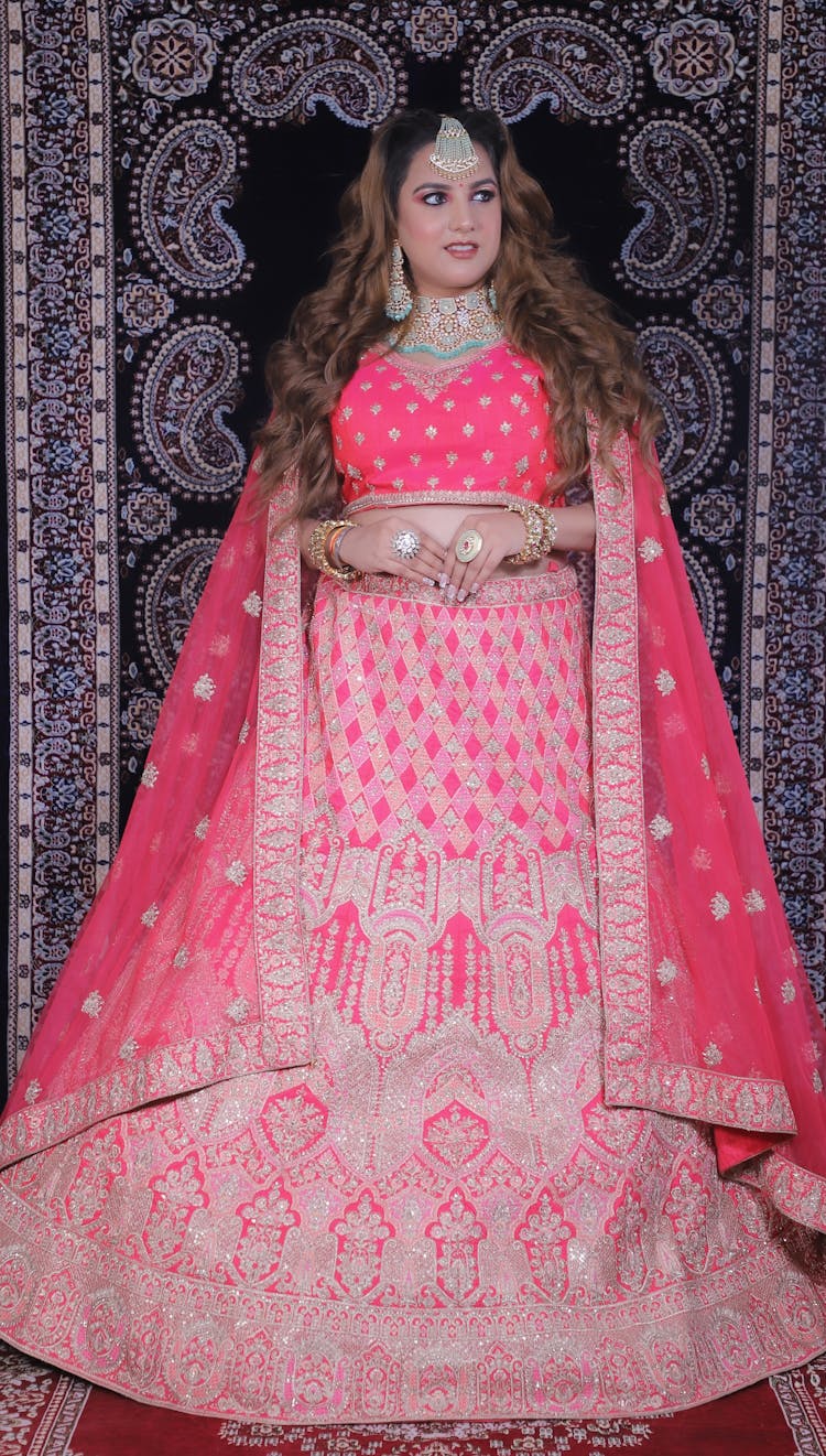 A Woman In Pink And White Saree