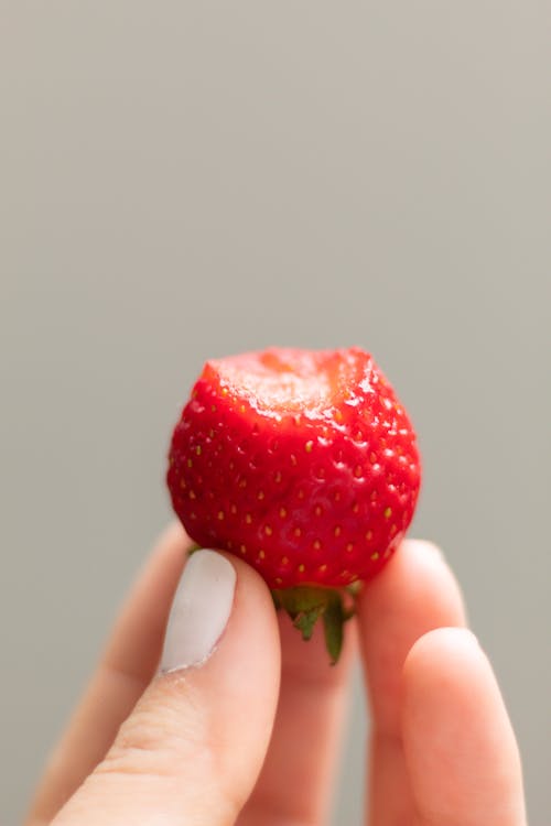 Foto d'estoc gratuïta de fotografia d'aliments, fruita, mà