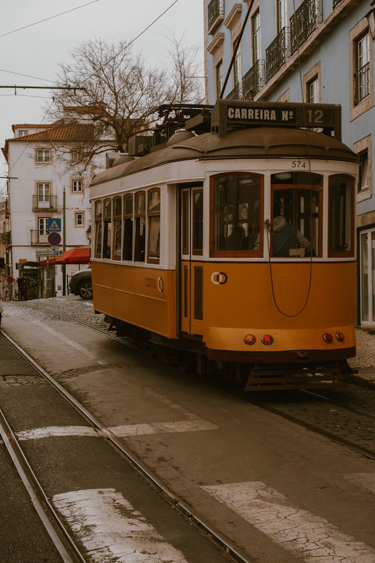 Orange And White Tram On Road