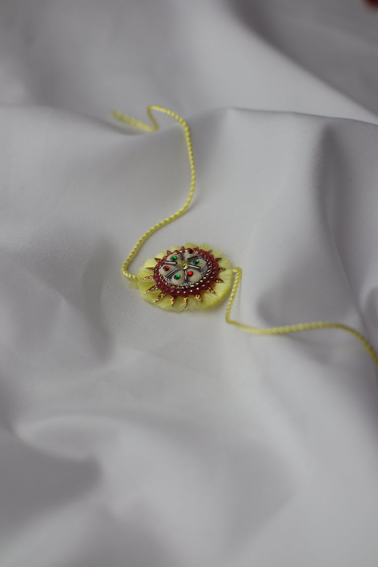 Rakhi On White Cloth