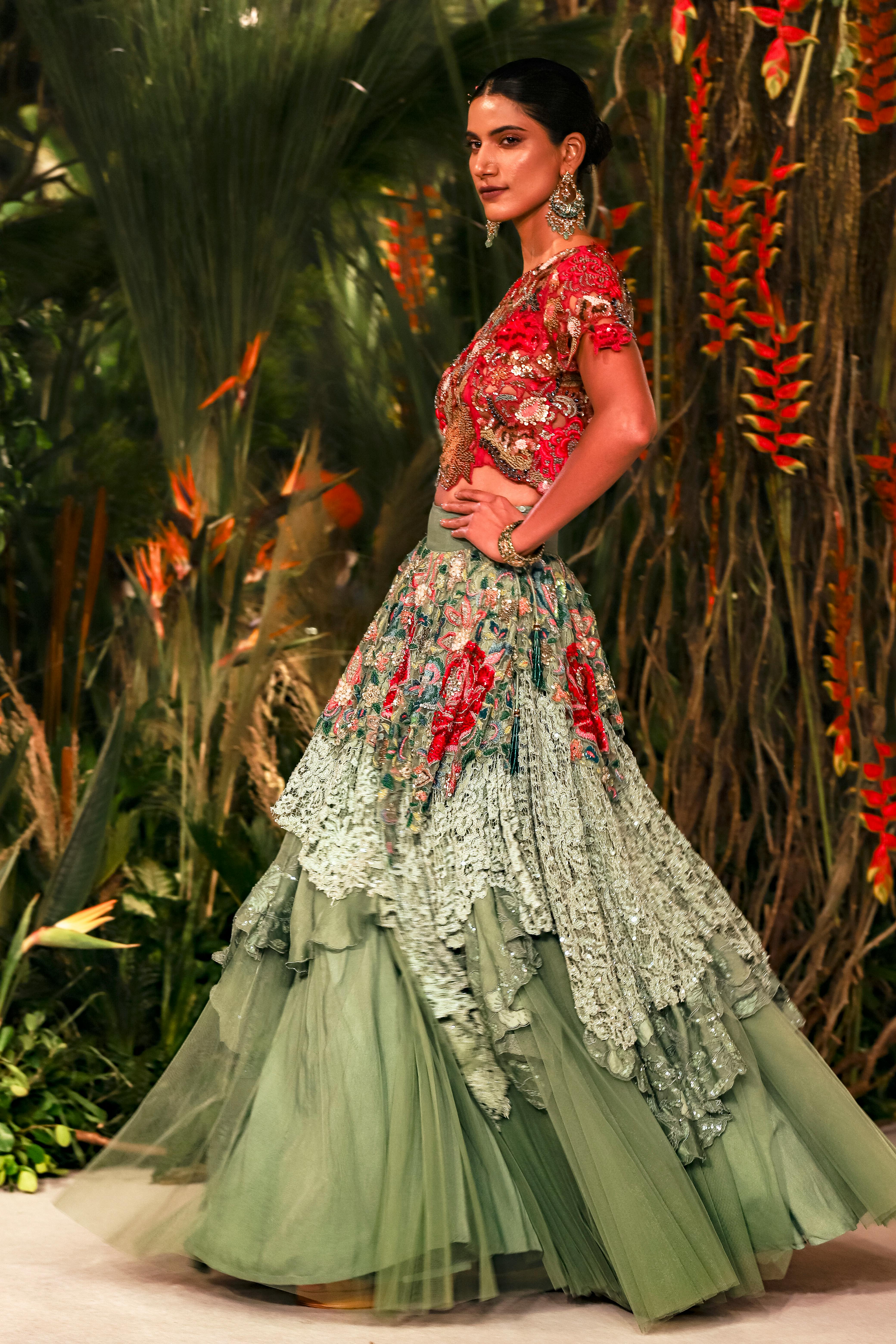 Green and red crop blouse with structured shoulders for runway look