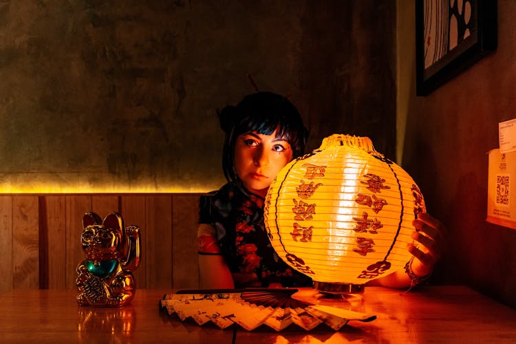 A Woman In Kimono Holding A Chinese Lantern