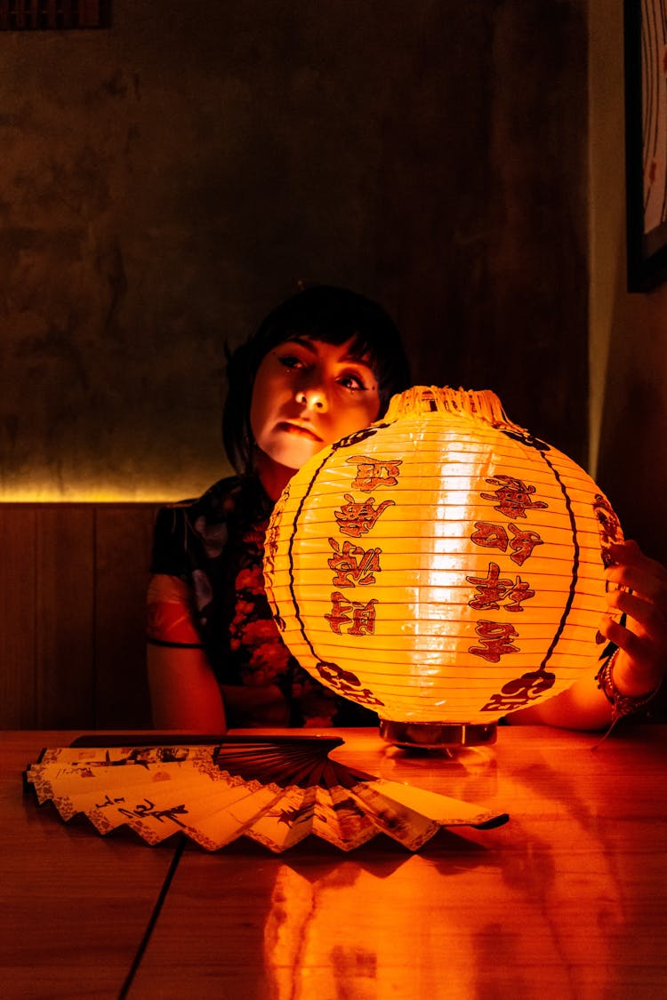 A Woman In Kimono Holding A Chinese Lantern