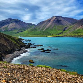 Coastal footpath above a fjord, photo by Lyn Ong on Pexels