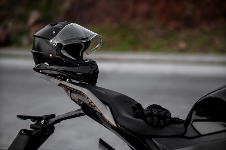 A Black Helmet Placed On A Motorcycle