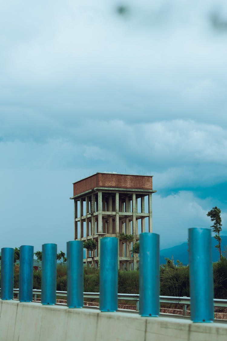 An Overhead Water Tank Under A Cloudy Sky