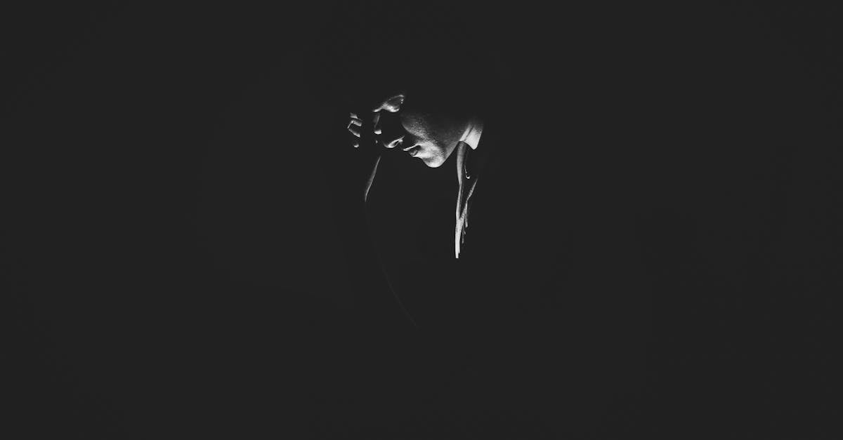 Monochrome Photography of Person On Dark Room