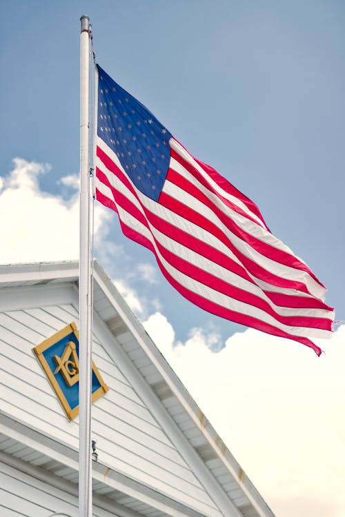 Free U.s.a. Flag Mounted on White Steel Pole Stock Photo