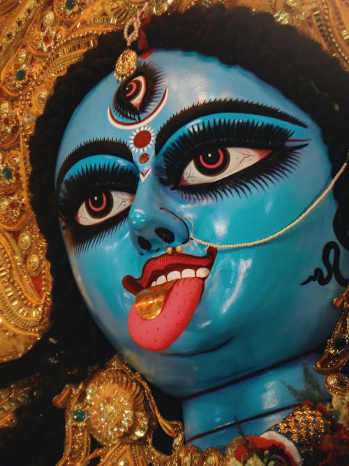 Blue Hindu Statue in Close Up Photography
