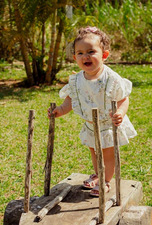 A Cute Girl in White Dress Smiling