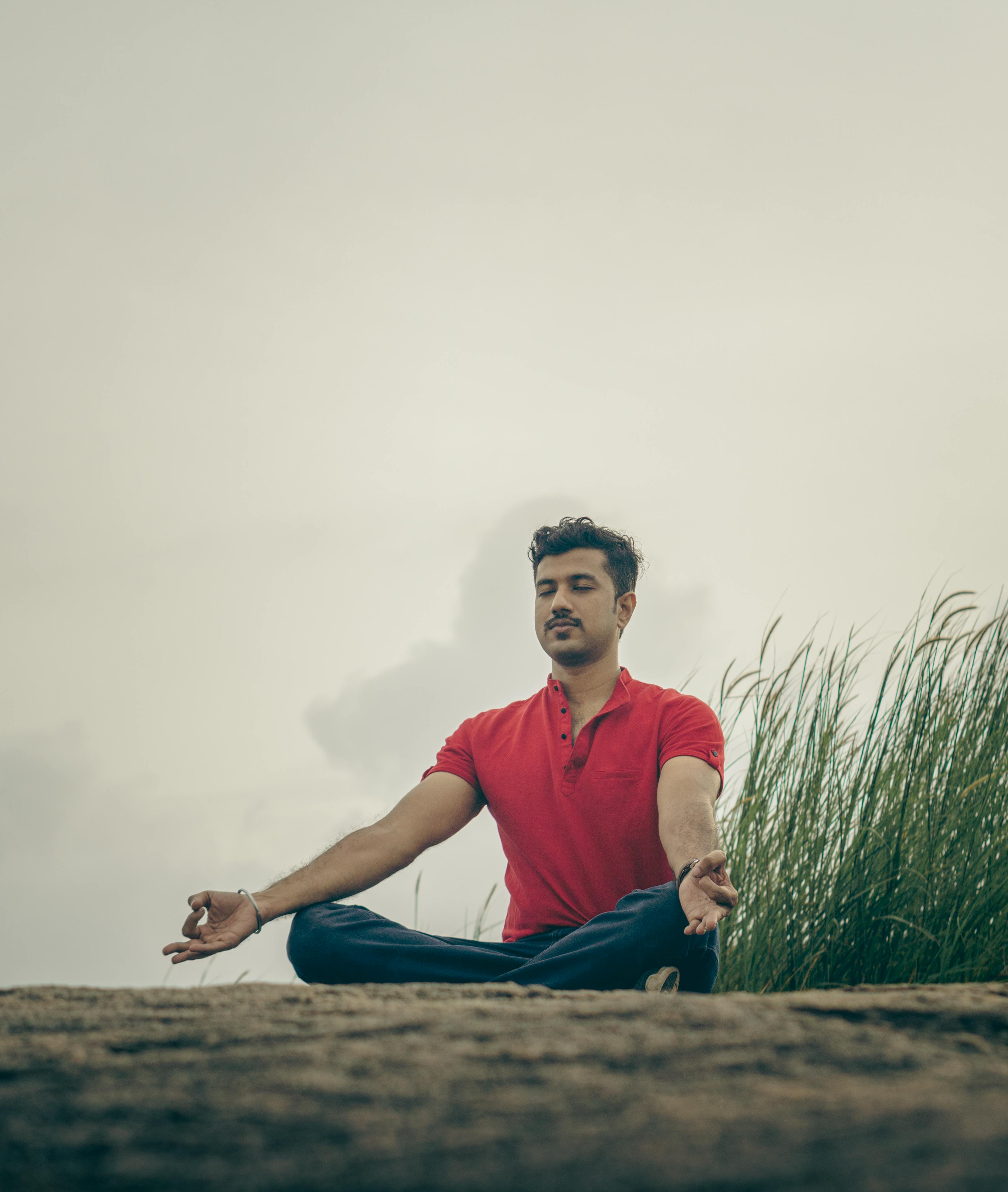 Person during Meditation in Seaside Gazebo · Free Stock Photo